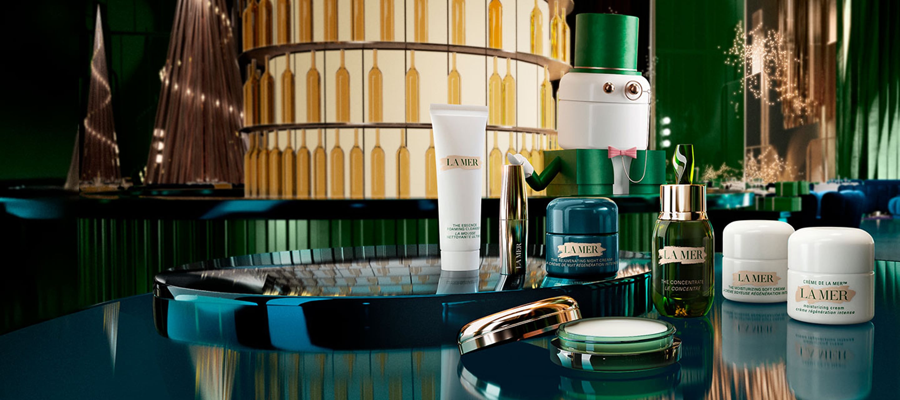 Selection of bestselling La Mer products placed on a festive, grand staircase, decorated in miniature masquerades and headwear